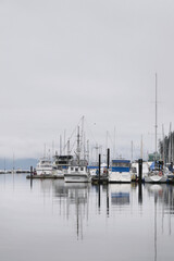 Fototapeta premium Boat harbour in Cowichan Bay during a winter season on Vancouver Island in British Columbia, Canada
