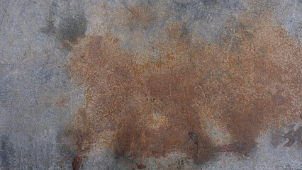 Dirty and stained grey and brown cement wall