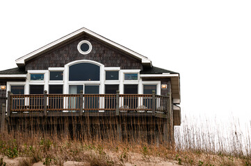 Outer Banks beach house against a white sky in Kill Devil Hills, North Carolina
