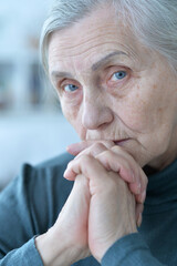 Close up portrait of a sick senior woman