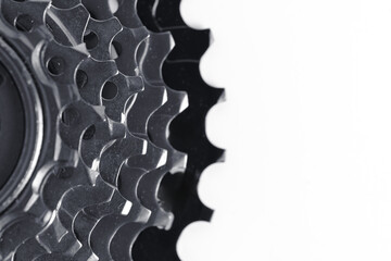 Closeup of a gear wheel on a white background with copy space. - obrazy, fototapety, plakaty
