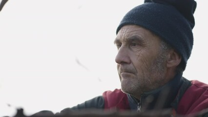 A man concentrating on gardening work