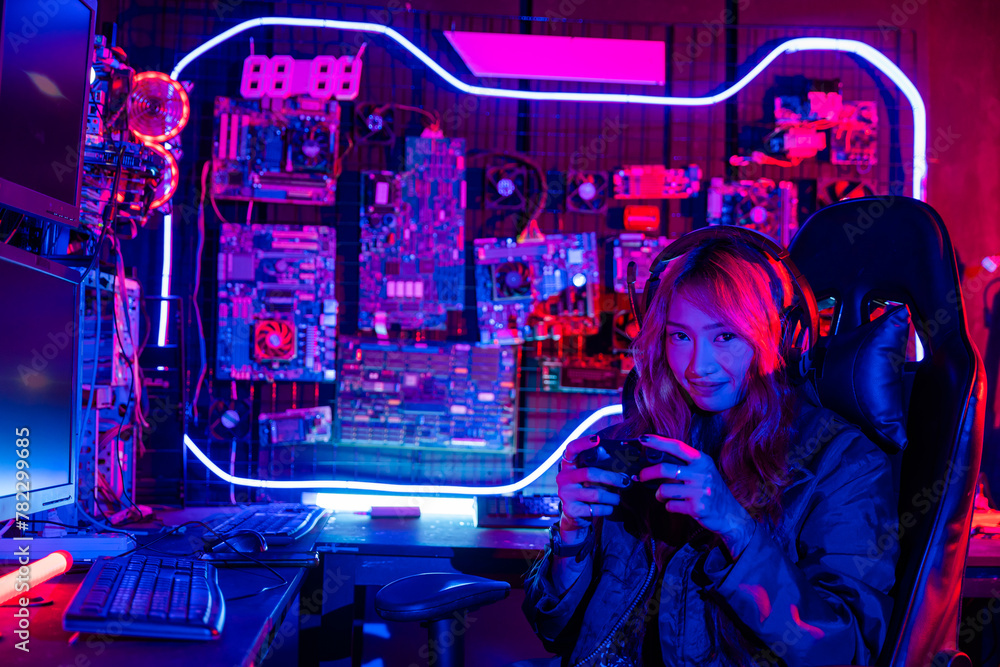 Poster gamer using joystick controller for virtual tournament plays online video game with computer neon li