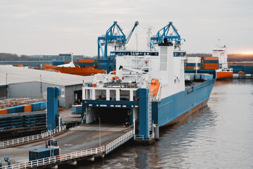 RORO Ship Loading Process In The Trade Port. Opened Rear Hydraulic Ramp During Cargo Operations.