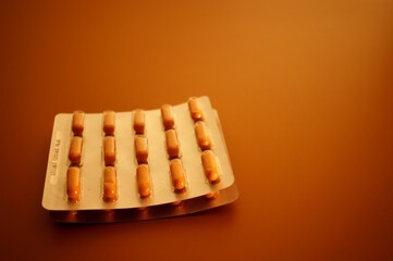 A package of dietary supplements is on the table. Medicine and pharmaceuticals.