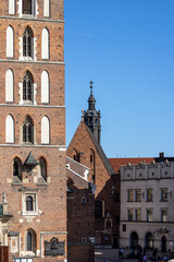 Fototapeta na wymiar Mariacki Square located between churches: St. Mary's Church and Church of St. Barbara, Krakow, Poland