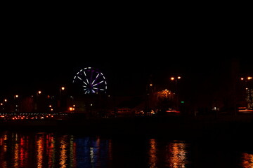 Ferris wheel at night on St. Patrick's Day. Kilkenny, Ireland