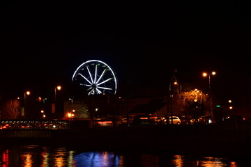 Ferris wheel at night on St. Patrick's Day. Kilkenny, Ireland