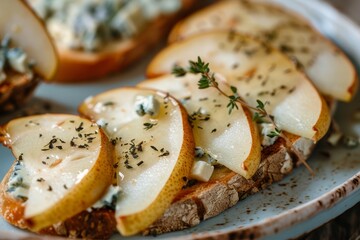 Blue cheese and pear crostini on a plate with thyme Selective focus