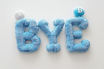 The word "BYE" in plush blue fabric letters with pillow texture on a white background.