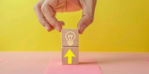 Hand holding a wooden block with light bulb, idea and creativity concept. - obrazy, fototapety, plakaty