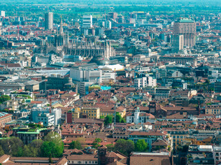 Aerial view of the Milan Cathedral. Duomo di Milano. Cathedral in white marble. Buttresses, pinnacles and spiers. Statue of the Madonnina. Lombardia. 04-11-2024. Italy - 782311459
