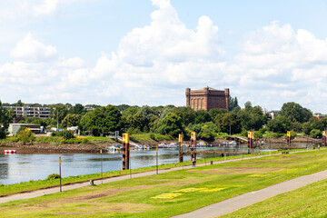 Panoramic view of the Weser River in the center of Bremen, Germany. Ancient water tower in the...