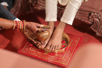 Indian Wedding Ceremony Ritual of WASHING Grooms FEET by Bride's Parents. Traditional Hindu Culture