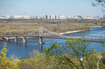 Pedestrian bridge over the Dnieper river in Kyiv in spring