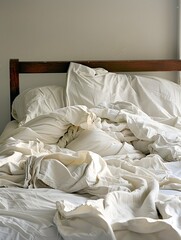 Fototapeta na wymiar Peaceful Slumber Disrupted - Disheveled Bedsheets Signify Restless Night's Sleep