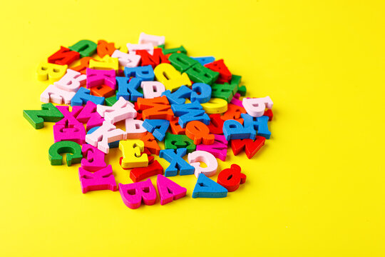 colored letters of the alphabet on a yellow background