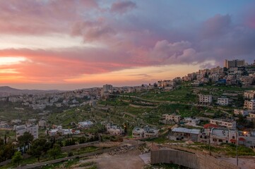 Fototapeta na wymiar Sunrise in Palestine, a peaceful landscape at dawn. night lights in old historical biblical city Bethlehem in palestine region in Israel. Bethlehem city at the morning.