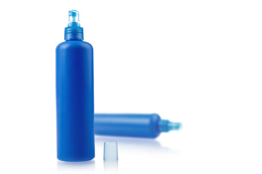 generic blue plastic hair product or skin care spray bottle with pump sprayer on white