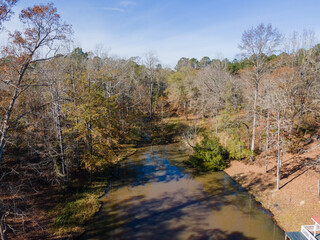 Fototapeta na wymiar Aerial landscape of trees and a pond in rural edge of southern Augusta Georgia