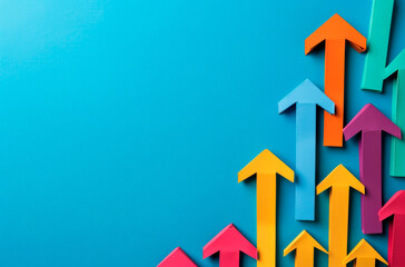 A group of bright, multicolored arrows point upward, symbolizing positive trends and growth against a vibrant blue backdrop, suggesting business progress or success metrics.