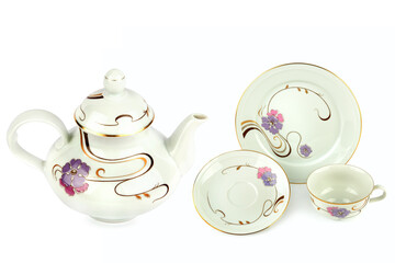 Vintage porcelain teapot, cups and saucers isolated on white. Collage.