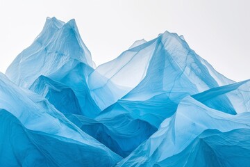Obraz premium Artistic Abstract Representation of Frozen Peaks Using Blue Fabric, Capturing the Essence of Cold and Elevation.