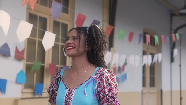 June Party in Brazil, smiling woman invited to dance at brazilian event in caipira clothes