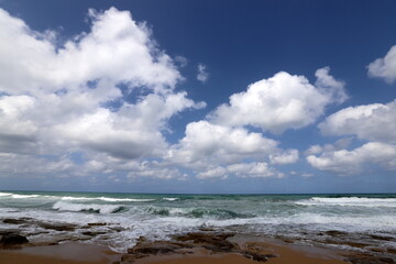 Rain clouds in the sky over the Mediterranean Sea.
