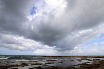 Rain clouds in the sky over the Mediterranean Sea.