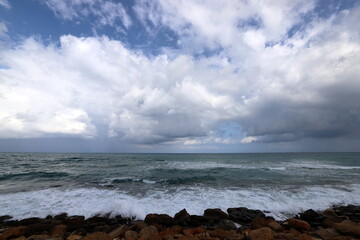Rain clouds in the sky over the Mediterranean Sea.