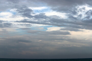 Rain clouds in the sky over the Mediterranean Sea.