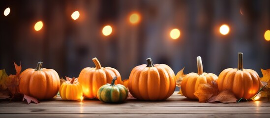 Pumpkins and Leaves on Wooden Table