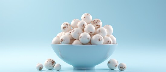 A bowl filled with eggs, including small ones, and topped with ice cream balls