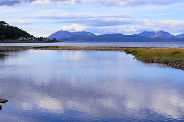 The Applecross River entering the Applecross Bay to Isle of Raasay and the Cuillins on the Isle of Skye, Scotland, UK