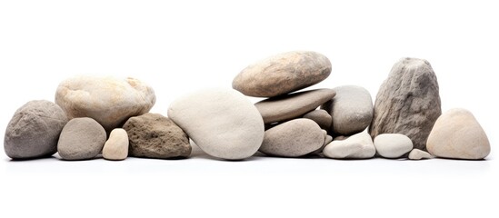 A stack of stones on a plain white surface