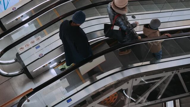 Escalators in the mall with people. Saint Petersburg, Russia - 12 April 2024. 4k video.