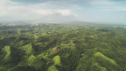 Aerial Philippines green jungle hills at Legazpi town, Asia. Tropical greenery forest with high...