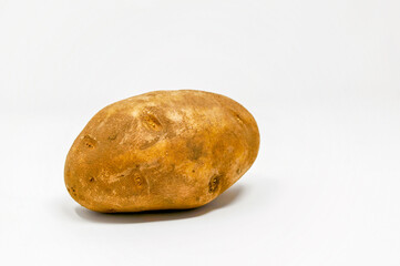 Fototapeta na wymiar A whole russet potato on a white background
