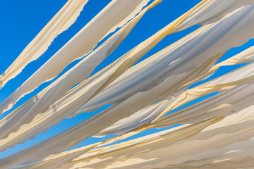 Ribbon decoration  in the desert coastal town (ghost town) of Jazeera Al Hamra includes a fort,...