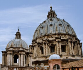 Obraz premium The dome of St. Peter's Basilica in Rome (Vatican) is one of the largest domes in the world and a masterpiece of Renaissance architecture