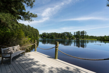 Sunny Serene Lake View from A Wooden Dock