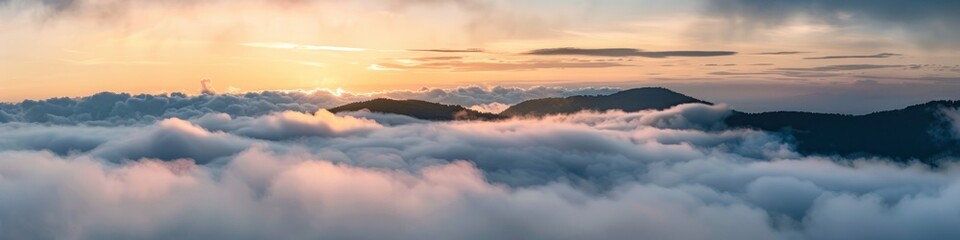 mountain peaks above the clouds.
