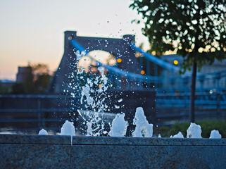 fountain on the background of the bridge
