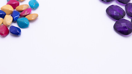 bright colored gemstones as a frame on white background