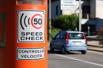 Cars Speed Check Machine on the street. Cars moving in background. Radar Speed Detector.  - obrazy, fototapety, plakaty