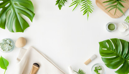 Fototapeta na wymiar Natural Beauty Products. Flat Lay with Green Leaves and Skincare Essentials. Relaxing Self-Care with Natural Skincare Products