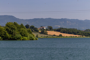 The Bilancino Lake. Lago di Bilancino, Barberino del Mugello, Florence, Italy: landscape at dawn of the picturesque lake in the Tuscan hills