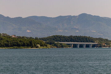 The Bilancino Lake. Lago di Bilancino, Barberino del Mugello, Florence, Italy: landscape at dawn of the picturesque lake in the Tuscan hills