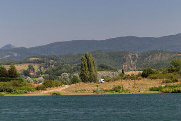 The Bilancino Lake. Lago di Bilancino, Barberino del Mugello, Florence, Italy: landscape at dawn of the picturesque lake in the Tuscan hills